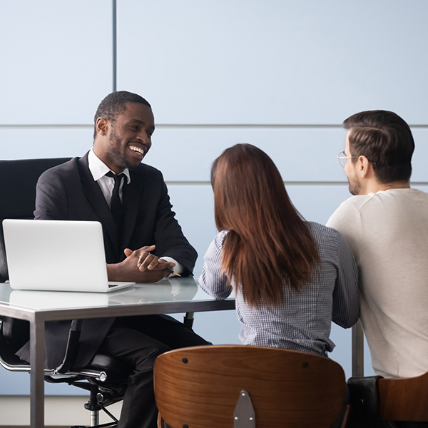 man and woman negotiating deal with lawyer