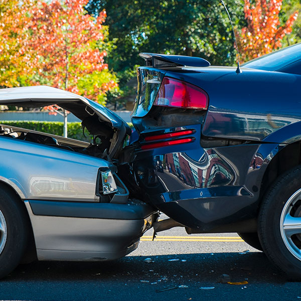 Auto accident involving two cars on a city street