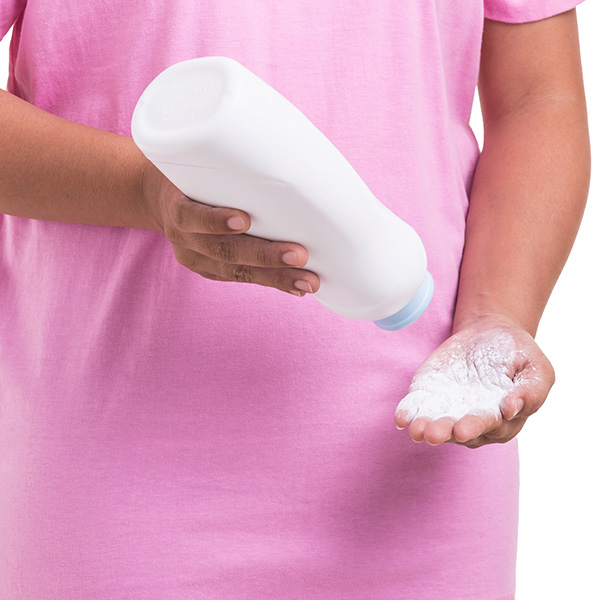woman holding white powder