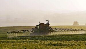 Farm equipment spraying crops in Oshawa, Ontario, Canada
