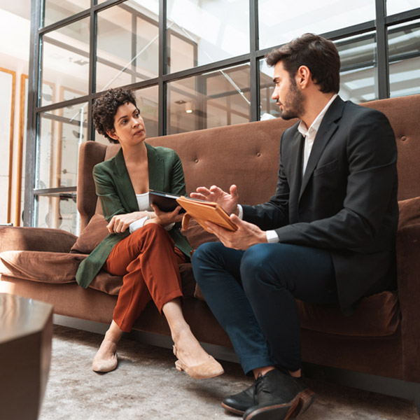 two business professionals talking in office