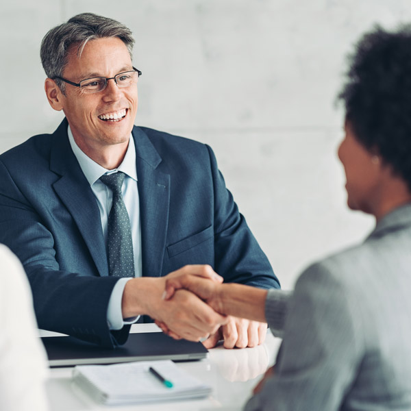 lawyer shaking hands with client